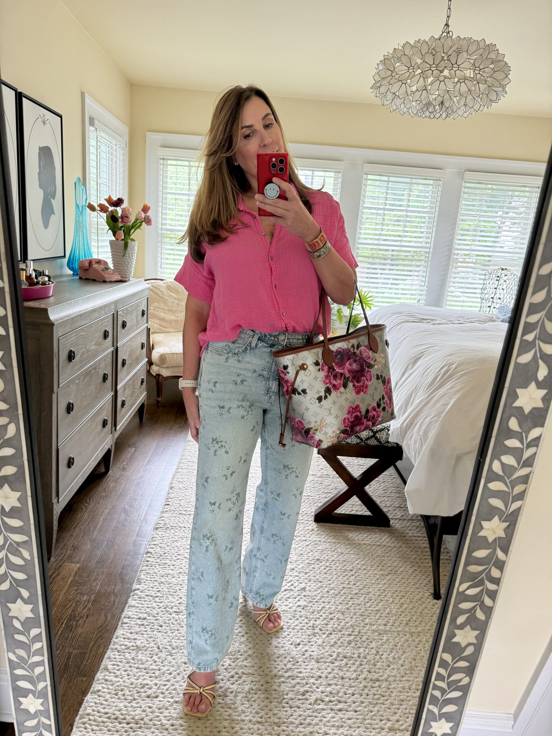 Kelly Elko in a pair of Floral jeans from Target and a Louis Vuitton tote bag with pink flowers / kellyelko.com