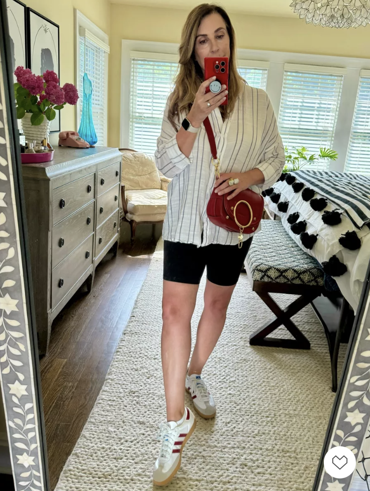 Kelly Elko ready for errands with flattering bike shorts and a flowing striped button down top with red Sambas and crossbody bag / kellyelko.com