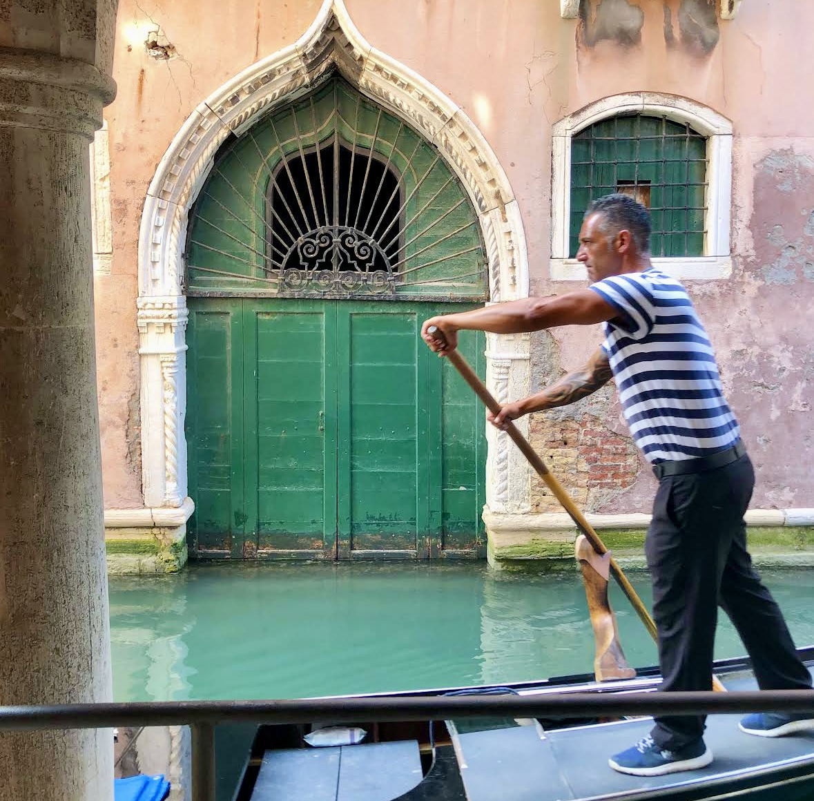Gondolier in Venice with Green Door / kellyelko.com