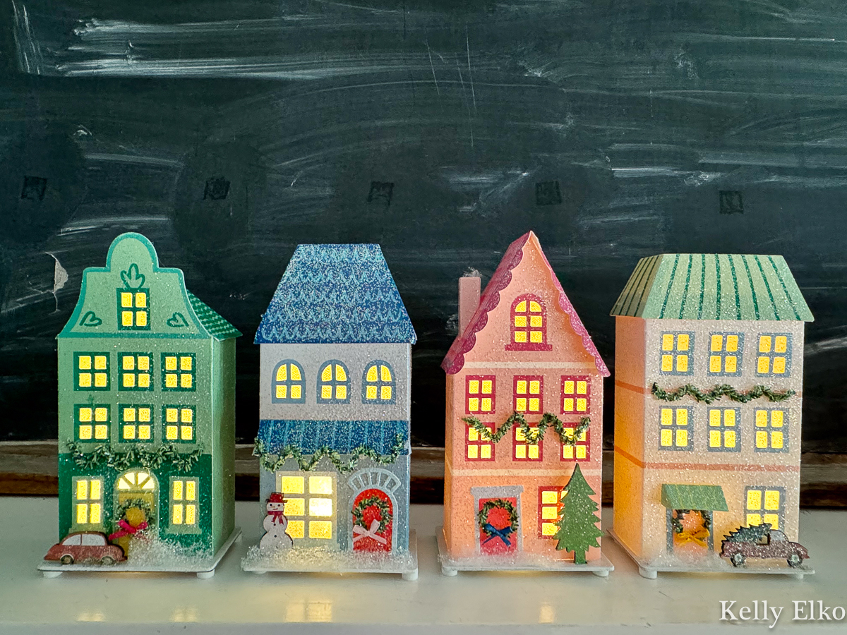 Colorful paper Christmas houses light up