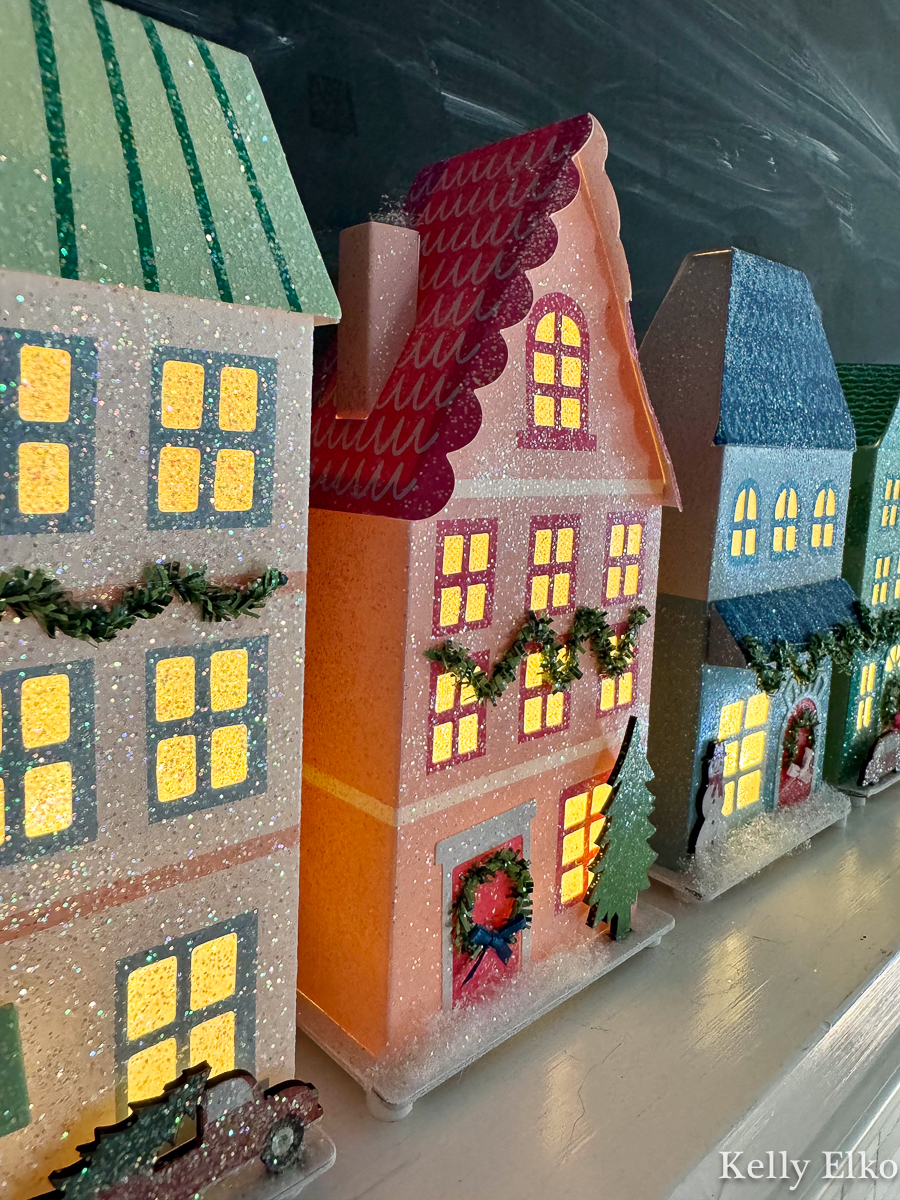 Colorful, whimsical paper Christmas house village that lights up. The perfect, affordable dupe to the expensive Anthro ones
