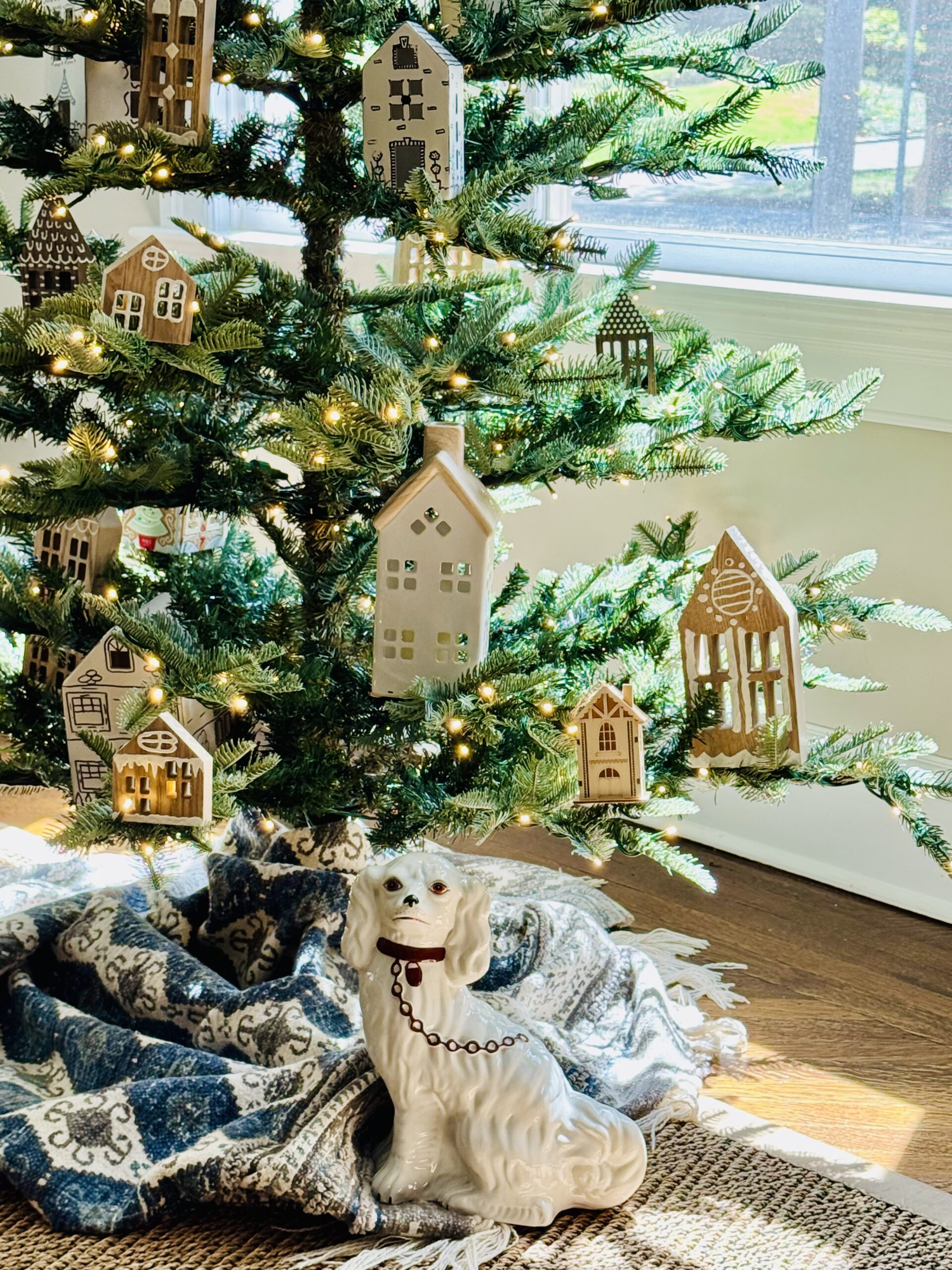 Sparse Christmas Tree with ceramic and wood painted houses as ornaments / kellyelko.com